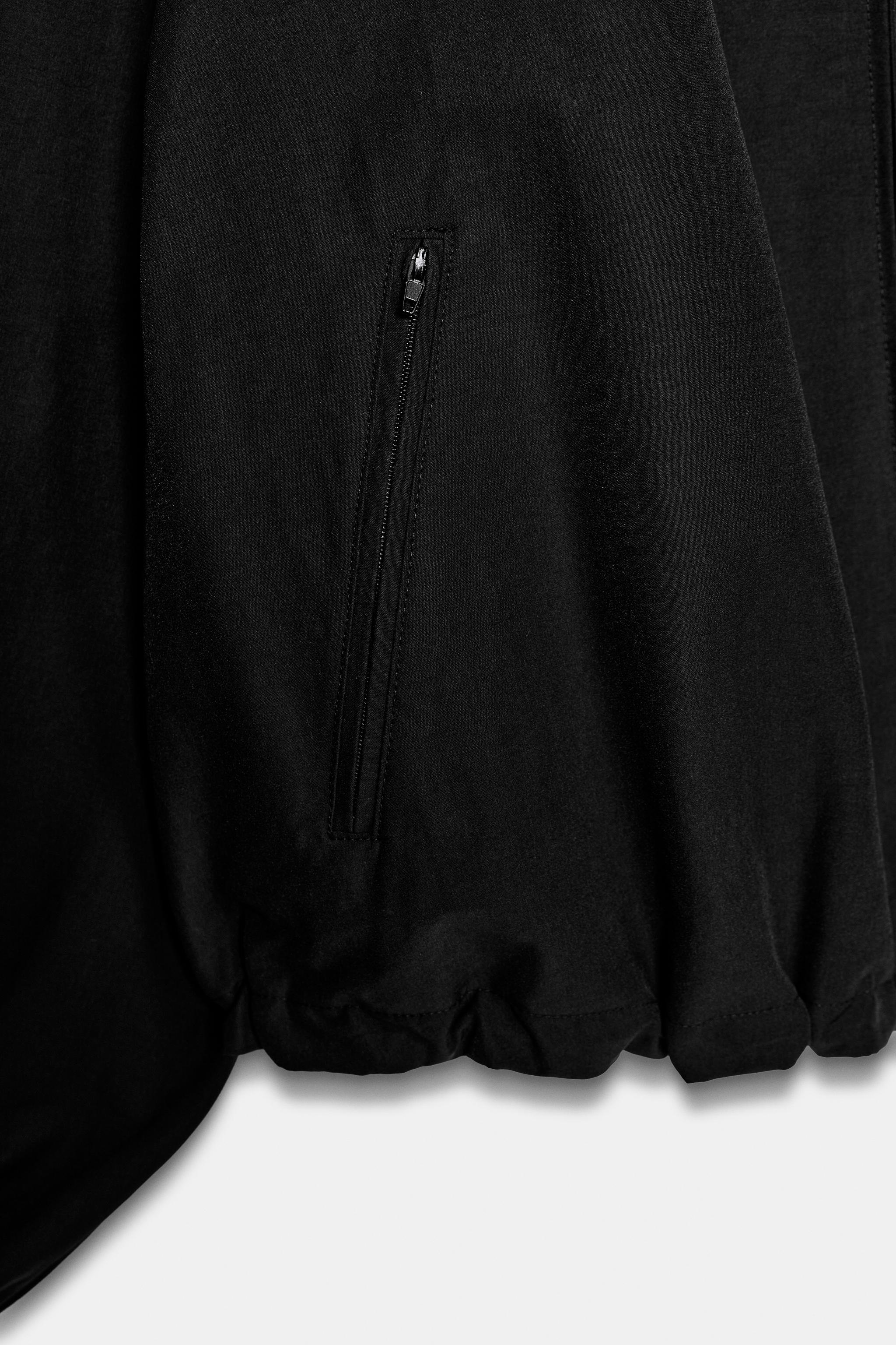 VESTE EN TISSU TECHNIQUE À ÉPAULIETTES